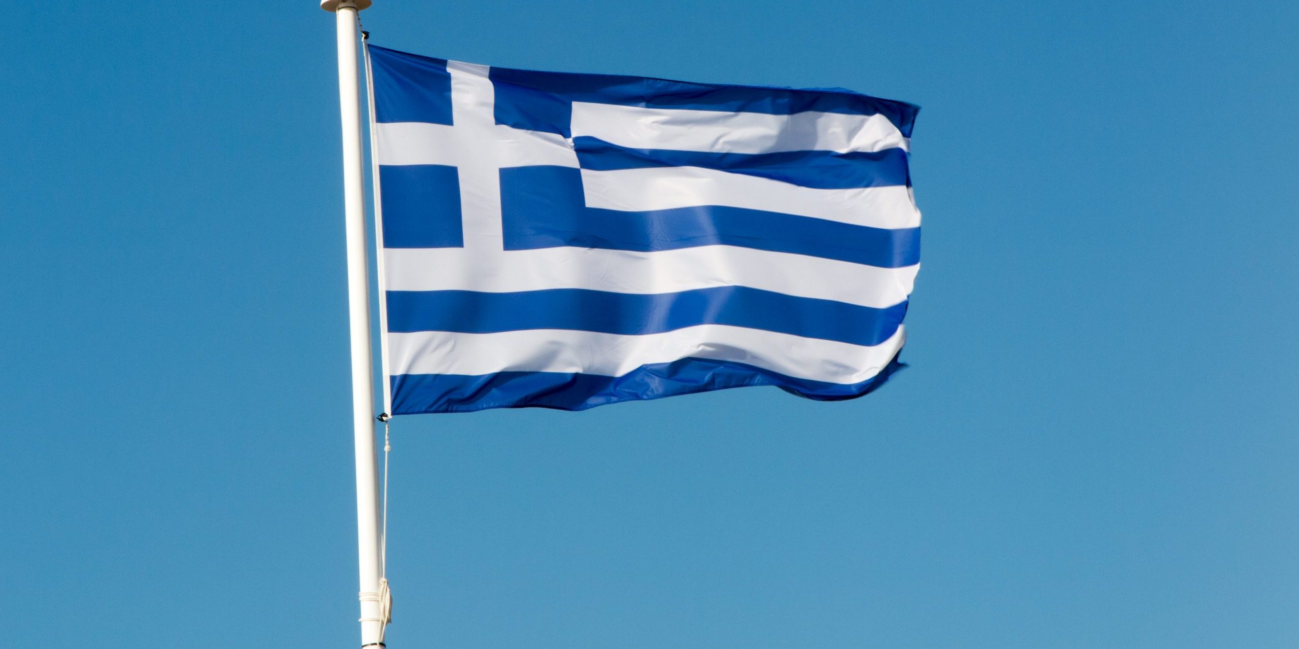 National flag of Greece against blue sky background